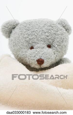 Teddy bear wrapped in blanket, close-up View Large Photo Image Stock Image - Teddy bear wrapped in blanket, close-up. Fotosearch