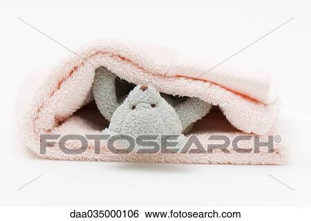 Teddy bear wrapped up in folded blanket View Large Photo Image Stock Photograph - Teddy bear wrapped up in folded blanket. Fotosearch