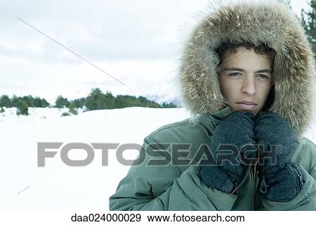 Teen boy wearing parka in snowy landscape View Large Photo Image Stock Photo - Teen boy wearing parka in snowy landscape. Fotosearch