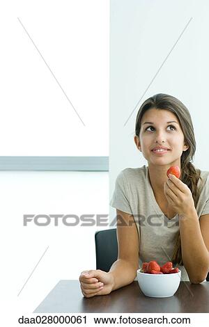 Teen girl eating strawberries View Large Photo Image Stock Image - Teen girl eating strawberries. Fotosearch