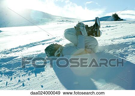 Teen girl lying on back in snow View Large Photo Image Stock Photo - Teen girl lying on back in snow. Fotosearch
