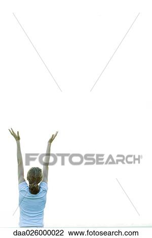 Teenage girl with arms raised, rear view View Large Photo Image Stock Image - Teenage girl with arms raised, rear view. Fotosearch