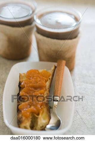 Toast with jam and cups of hot chocolate View Large Photo Image Stock Image - Toast with jam and cups of hot chocolate. Fotosearch