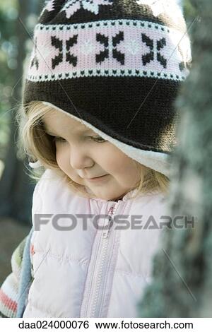 Toddler girl wearing winter clothes, close-up View Large Photo Image Stock Photograph - Toddler girl wearing winter clothes, close-up. Fotosearch