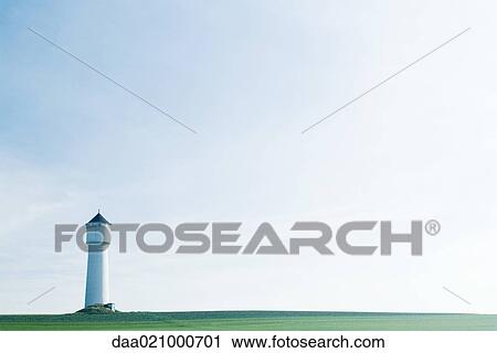 Tower in green field View Large Photo Image Stock Image - Tower in green field. Fotosearch