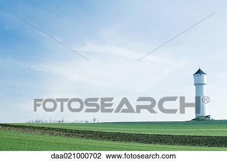 Tower in green field View Large Photo Image Stock Image - Tower in green field. Fotosearch