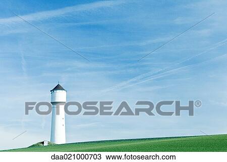 Tower in green field View Large Photo Image Stock Image - Tower in green field. Fotosearch