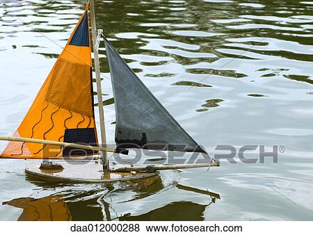 Stock Photo - Toy boat in water. Fotosearch