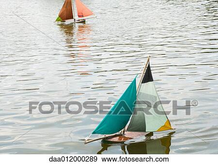 Toy boats in water View Large Photo Image Stock Photo - Toy boats in water. Fotosearch