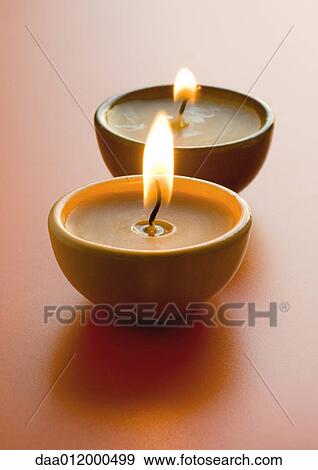Stock Photo - Two lit candles. Fotosearch