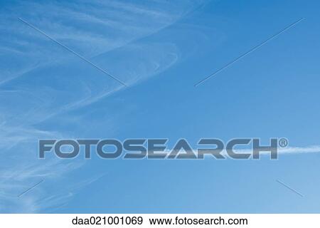 Stock Photo - Vapor trail and clouds. Fotosearch