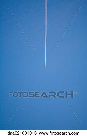 Vapor trail in blue sky View Large Photo Image Stock Image - Vapor trail in blue sky. Fotosearch