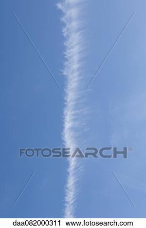 Vapor trail in blue sky View Large Photo Image Stock Image - Vapor trail in blue sky. Fotosearch