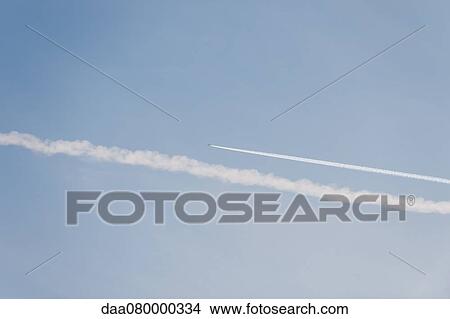 Picture - Vapor trails in sky. Fotosearch