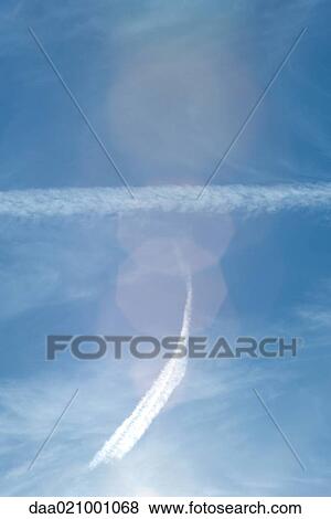 Stock Photo - Vapor trails in sky. Fotosearch