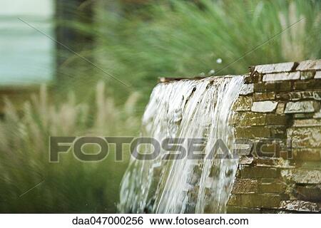 Water flowing over dam View Large Photo Image Stock Photograph - Water flowing over dam. Fotosearch