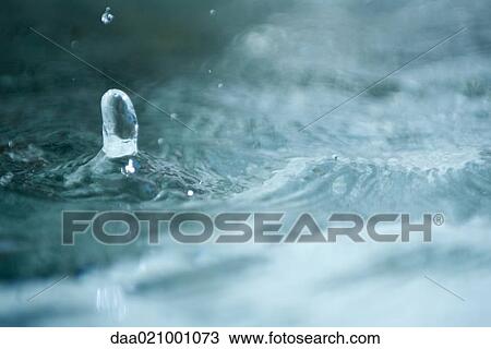 Stock Image - Water splashing, extreme close-up. Fotosearch
