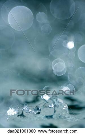 Stock Image - Water splashing, extreme close-up. Fotosearch