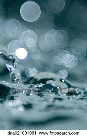 Stock Image - Water splashing, extreme close-up. Fotosearch