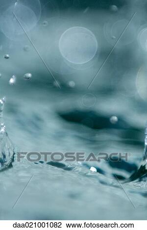 Stock Image - Water splashing, extreme close-up. Fotosearch