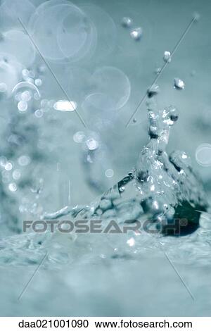 Stock Image - Water splashing, extreme close-up. Fotosearch