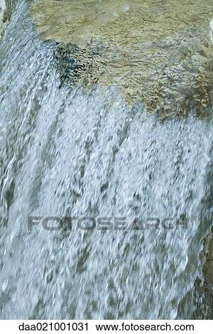 Stock Image - Waterfall, partial view, close-up. Fotosearch