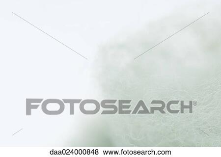 Stock Photo - White fibers on white background, extreme close-up. Fotosearch