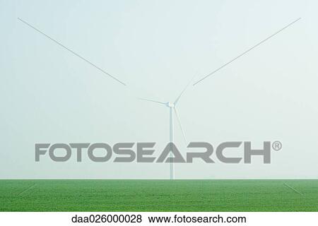 Stock Photo - Wind turbine in field of grass. Fotosearch