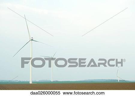 Wind turbines in field View Large Photo Image Stock Photography - Wind turbines in field. Fotosearch