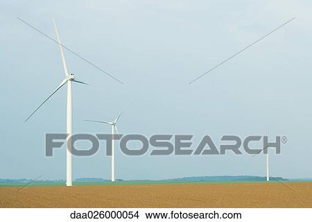 Wind turbines in plowed field View Large Photo Image Picture - Wind turbines in plowed field. Fotosearch
