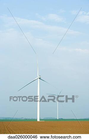 Wind turbines in plowed field View Large Photo Image Stock Photograph - Wind turbines in plowed field. Fotosearch