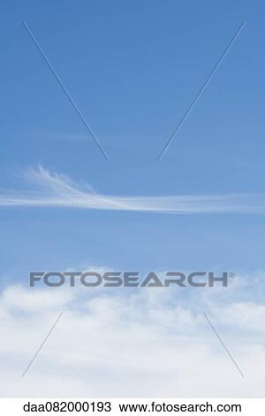 Wispy clouds in blue sky View Large Photo Image Stock Image - Wispy clouds in blue sky. Fotosearch