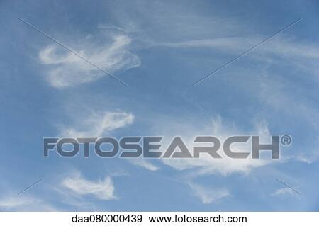 Wispy clouds in sky View Large Photo Image Stock Photo - Wispy clouds in sky. Fotosearch