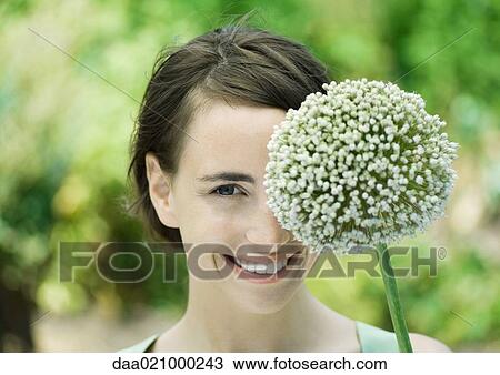 Woman and allium flower View Large Photo Image Stock Image - Woman and allium flower. Fotosearch
