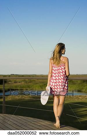 Woman at scenic lookout admiring view View Large Photo Image Stock Image - Woman at scenic lookout admiring view. Fotosearch