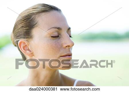 Woman closing eyes View Large Photo Image Stock Image - Woman closing eyes. Fotosearch