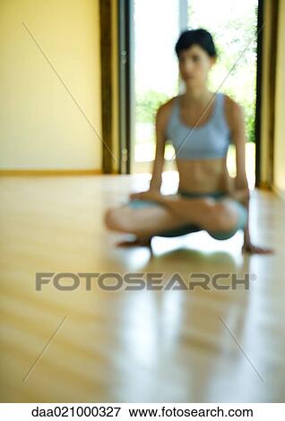 Stock Photo - Woman doing arm pressure pose. Fotosearch
