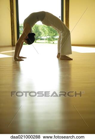 Woman doing bridge position, side view View Large Photo Image Stock Photo - Woman doing bridge position, side view. Fotosearch