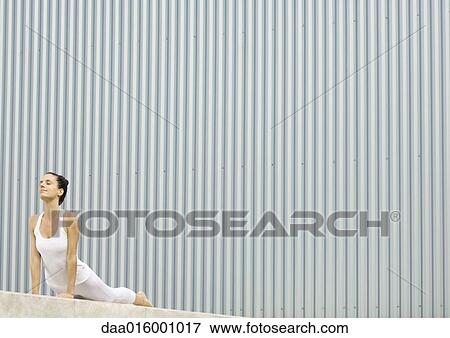 Stock Photo - Woman doing cobra pose. Fotosearch