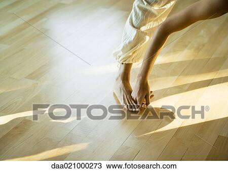 Woman doing prasarita padottanasana posture, cropped view of leg and arm View Large Photo Image Stock Image - Woman doing prasarita padottanasana posture, cropped view of leg and arm. Fotosearch