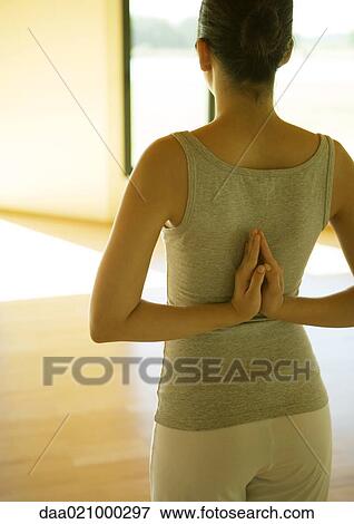 Woman doing yoga pose, rear view View Large Photo Image Stock Photo - Woman doing yoga pose, rear view. Fotosearch