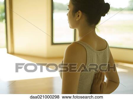 Woman doing yoga pose, rear view View Large Photo Image Stock Photo - Woman doing yoga pose, rear view. Fotosearch