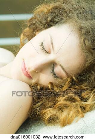 Stock Image - Woman, eyes closed, close-up. Fotosearch