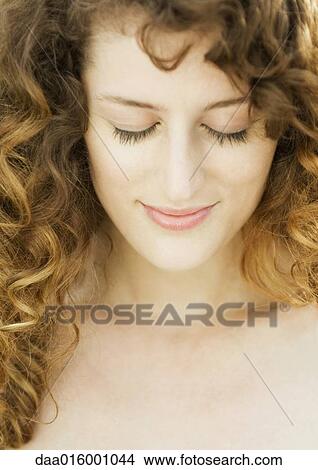 Picture - Woman, eyes closed, head and shoulders, close-up. Fotosearch