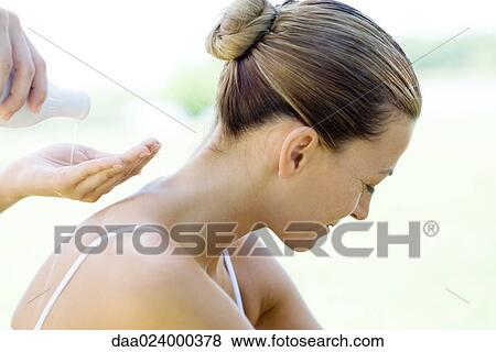 Woman having back massage, massage therapist pouring oil into palm of hand View Large Photo Image Stock Photo - Woman having back massage, massage therapist pouring oil into palm of hand. Fotosearch