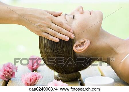 Woman having head massage View Large Photo Image Picture - Woman having head massage. Fotosearch