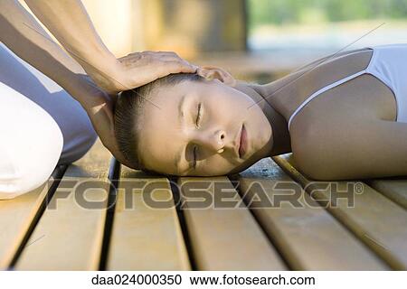Stock Image - Woman having head massage. Fotosearch
