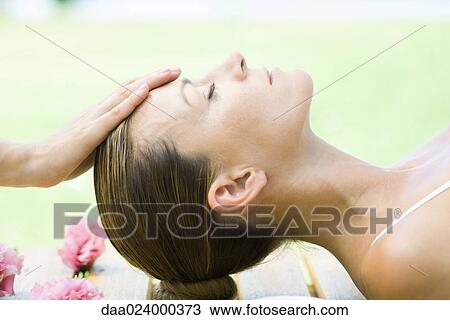 Stock Image - Woman having head massage. Fotosearch