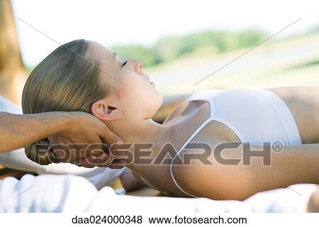 Woman having neck massage View Large Photo Image Stock Photo - Woman having neck massage. Fotosearch