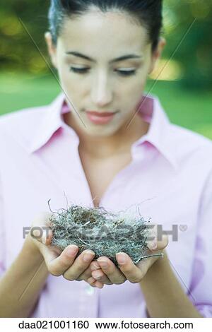 Woman holding nest View Large Photo Image Stock Image - Woman holding nest. Fotosearch